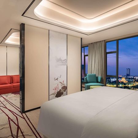 Ramada By Wyndham Mengzi Suites Экстерьер фото